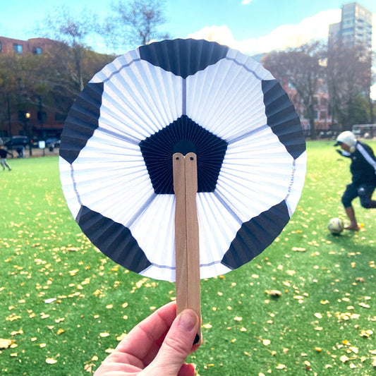 Kikkerland Soccer Paper Fan in use